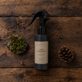 Cabin after Rain room spray, 4 oz matte black plastic bottle, shown flat